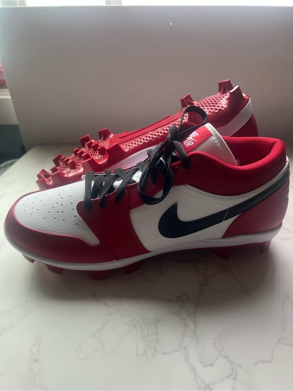 Jordan Red and White Retro Baseball Cleats.